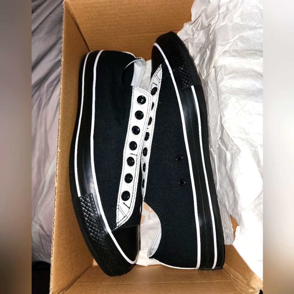 NWB, Chuck Taylor's slip on, black & white in a size 10.5, see photos